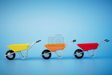 Téléchargez les photos : Multi-colored construction wheelbarrows on a blue background. 3D render. - en image libre de droit