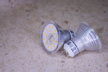 Photo for Led light bulb with yellow and white stripes GU10 base type connection - Royalty Free Image