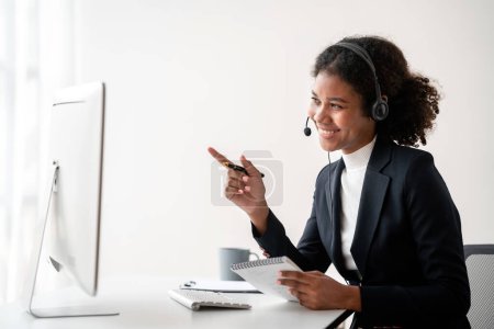 Photo for Female call center provides information to a customer calling for help, Contact us, Service with a beautiful and friendly voice, Long call distance communication, Talk using headphones or headsets. - Royalty Free Image