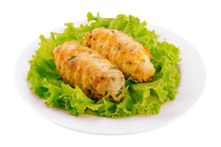 Chicken cutlets with salad greens on plate