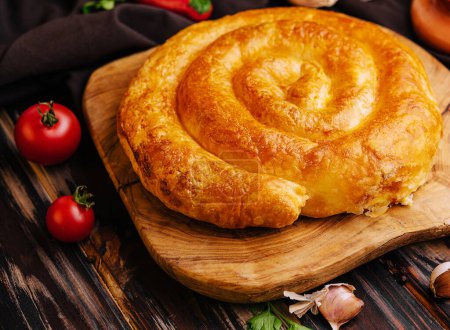 Photo for Whole homemade baked traditional Greek cheese pie - Royalty Free Image
