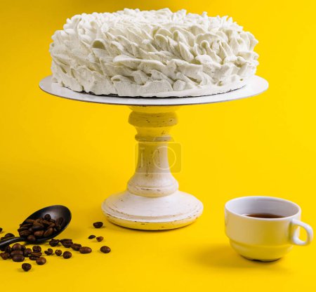 Coffee Mousse Cake with Coffee Cup on Yellow Background
