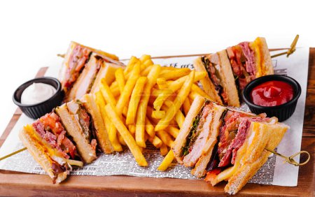 Mini sandwiches with ham and fries with sauces
