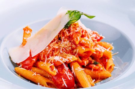 Italian style pasta with tomato sauce and parmesan