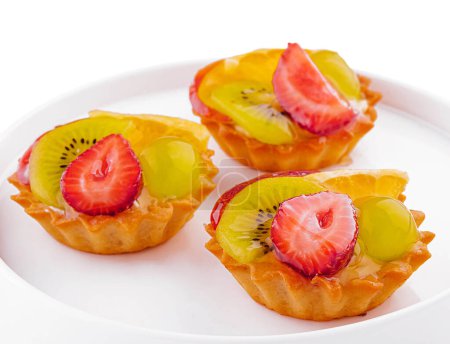 Mini tarts with cream and mix of summer fruit
