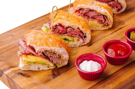 Mini sandwiches with ham and sauces