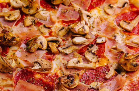 Photo for Pizza with ham, salami and mushrooms close up - Royalty Free Image