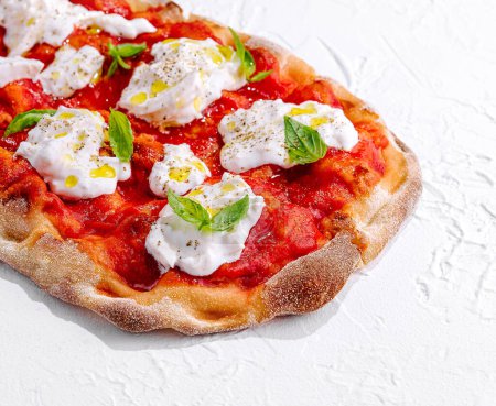 Pizza Margherita on white stone