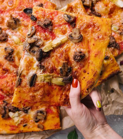 pizza with minced meat, artichokes and mushrooms