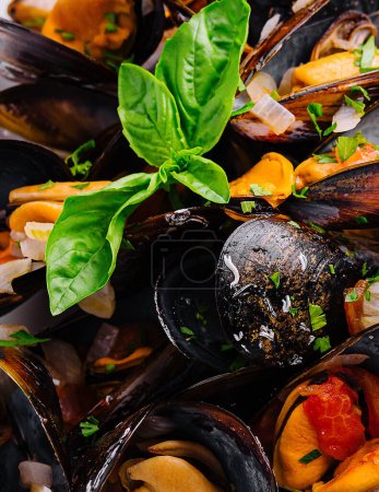 Delicious seafood mussels with sauce and parsley