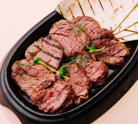 Photo for Grilled meat steak veal medallions with pita - Royalty Free Image