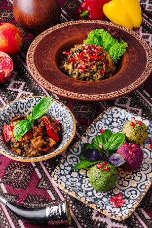 Exotic dishes with vibrant garnishes served in decorative bowls on a patterned textile surface