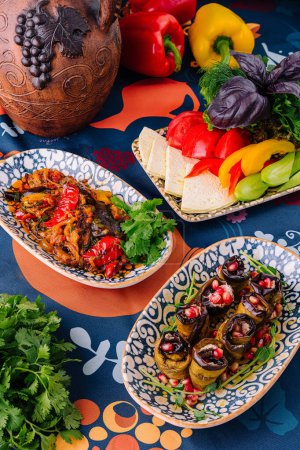 Vibrant dishes of a mediterranean meal laid out on a decorative tablecloth