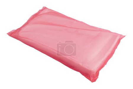 Single pink polythene plastic bag ideal for packaging, isolated on a white backdrop