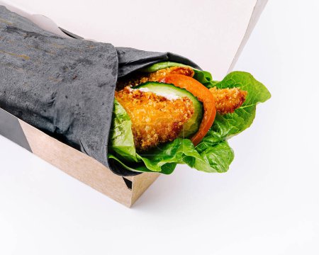 Healthy vegetable wrap in eco-friendly packaging, isolated on a white background for easy takeaway meal concepts