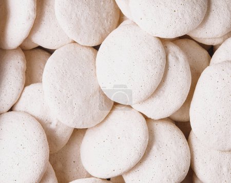 Photo for Top view homemade white meringue cookies close up - Royalty Free Image