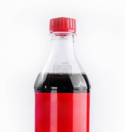 Sealed plastic bottle of soda with a red label on a pure white backdrop