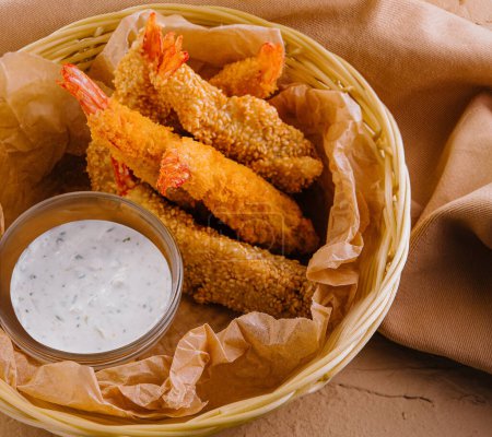 Delectable arrangement of crispy fried shrimp with tartar sauce in wicker baskets