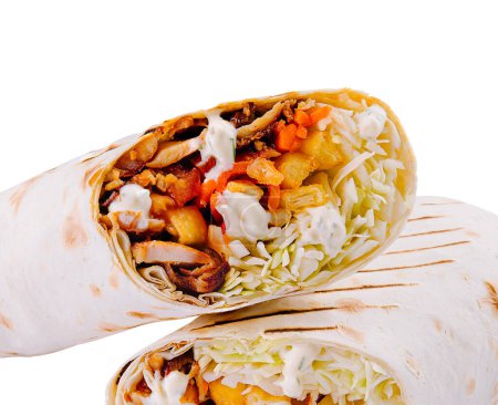 Close-up of a delicious vegetarian wrap sliced in half, isolated on a white background
