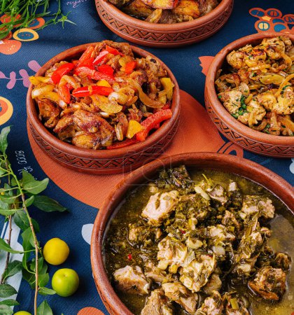 Vibrant assortment of african stews served in pottery on a patterned cloth