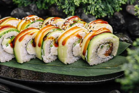 Maki Sushi - Rolls Cucumber outside on a bamboo leaf top view
