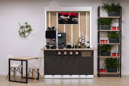 Stylish coffee area with machine and accessories in a contemporary office setting