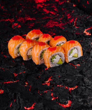 Vibrant salmon sushi rolls on a unique black and red textured background