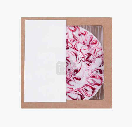 Indulge in a ready-to-eat gourmet treat with this pre-packaged cherry cheesecake dessert in a cardboard packaging adorned with a beautiful swirl design