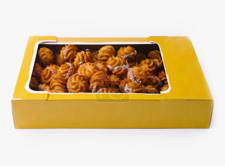 Box of traditional moldovan sweet pastries isolated on a white background