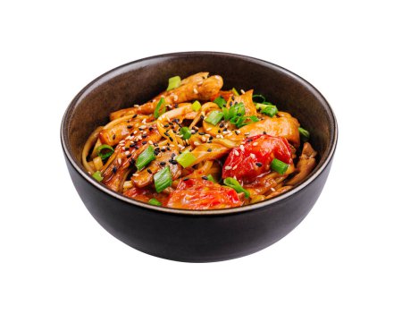 Delicious asian-style stir-fried noodles with vegetables and sesame seeds in a black bowl on a white background