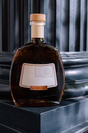 Luxurious cognac bottle elegantly displayed on a dark surface