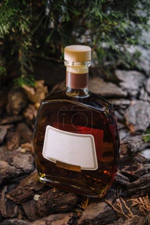 High-quality image showcasing a crafted bottle of cognac amid natural wooden textures