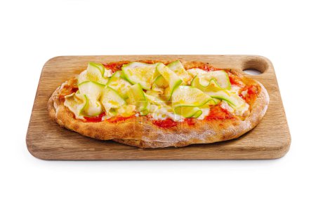 Gourmet zucchini pizza with zucchini and cheese toppings, served on a cutting board against a white background