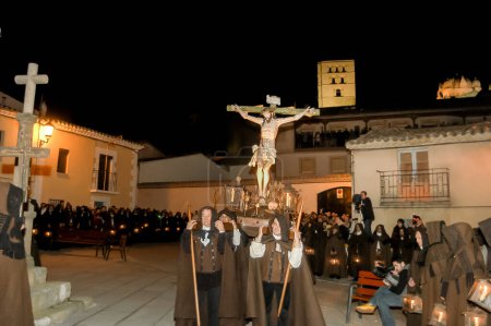Photo for Holy Week in Zamora on the night of Holy Wednesday, procession of the Brown Capes of the Brotherhood of Penitence of the Holy Christ of Shelter. - Royalty Free Image