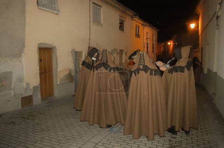 Photo for Holy Week in Zamora on the night of Holy Wednesday, procession of the Brown Capes of the Brotherhood of Penitence of the Holy Christ of Shelter. - Royalty Free Image