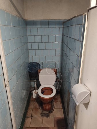 Photo for An old dirty toilet in the toilet - Royalty Free Image