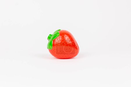 Photo for Plastic children's toy strawberry on a white background - Royalty Free Image
