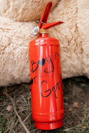 a Red extinguisher ready for a thrilling gender reveal