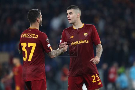 Photo for Rome, Italy 20.04.2023: Gianluca Mancini, Leonardo Spinazzola of Roma celebrate victory at end of the Uefa Europa League 2023 football match, quarter finals, AS Roma vs Feyenoord  at Olympic stadium in Rome, Italy. - Royalty Free Image