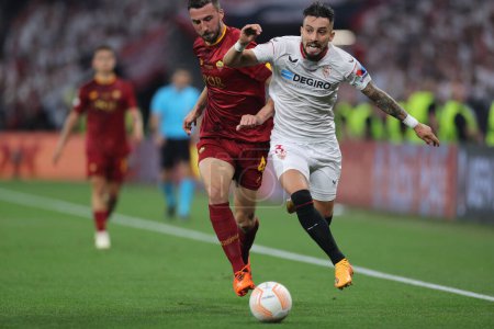 Photo for Budapest, Hungary: 31.05.2023: Bryan Cristante, Alex Telles of Seville. in action during the Final UEFA Europa League 2023  match between Sevilla FC vs AS Roma at Puskas Arena of Budapest in Hungar - Royalty Free Image