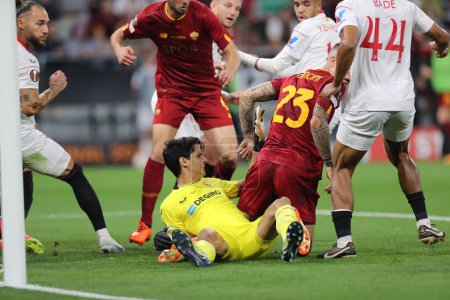 Photo for Budapest, Hungary: 31.05.2023:Yassine Bounou of Seville, Gianluca Mancini of Roma in action during the Final UEFA Europa League 2023  match between Sevilla FC vs AS Roma at Puskas Arena of Budapest in Hungar - Royalty Free Image