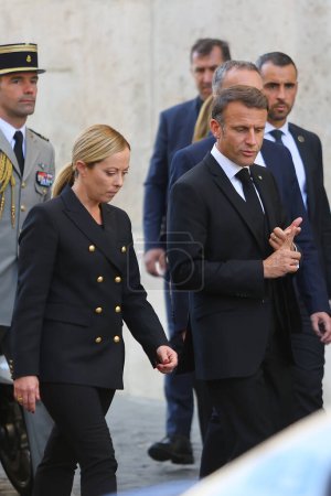 Photo for Rome, Italy 26.09.2023: Prime Minister Giorgia Meloni and President of the French Republic Emmanuel Macron walking and talking about immigrants after the state funeral of former President of the Republic Giorgio Napolitano, Rome, 26 September 2023. - Royalty Free Image