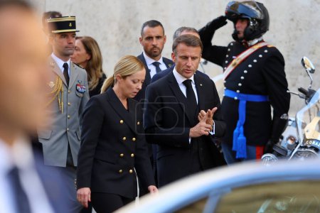 Photo for Rome, Italy 26.09.2023: Prime Minister Giorgia Meloni and President of the French Republic Emmanuel Macron walking and talking about immigrants after the state funeral of former President of the Republic Giorgio Napolitano, Rome, 26 September 2023. - Royalty Free Image