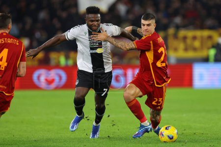 Photo for Rome, Italy 26.11.2023: Isaac Success of Udinese fight for the ball with Gianluca Mancini of Roma during the Italy Serie A TIM 2023-2024, football match between AS Roma vs Udinese Calcio at Olympic Stadium in Rome. - Royalty Free Image