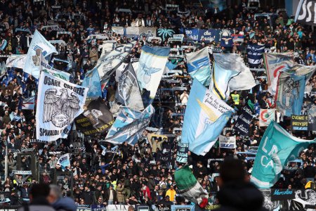 Photo for Rome, Italy 14.01.2024: Flags of Lazio fans in the stands in  the Italian Serie A TIM 2023-2024 football match SS Lazio vs US Lecce at Olympic Stadium in Rome. - Royalty Free Image