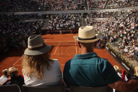 Photo for Rome, Italy 13.05.2024:  hatted spectators look match during Internazionali BNL 2024 Men's Atp 1000 Open tennis tournament  in Rome at Grand Stand Arena . - Royalty Free Image