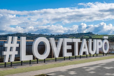 Photo for Hashtag Love Taupo sign in front of Lake Taupo in New Zealand. - Royalty Free Image