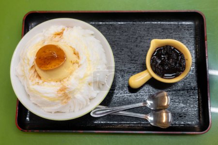 Bingsu, ice snow dessert, with flan pudding and mulberry.