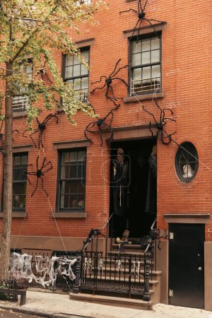 Halloween decoration on brick facade of building on street in New York City
