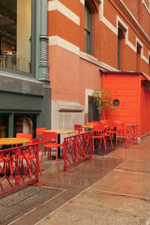 bistro tables on terrace of cafe on street in New York City